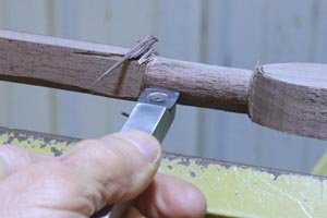 Turn handle on wooden spoon using a carbide cutter tool.